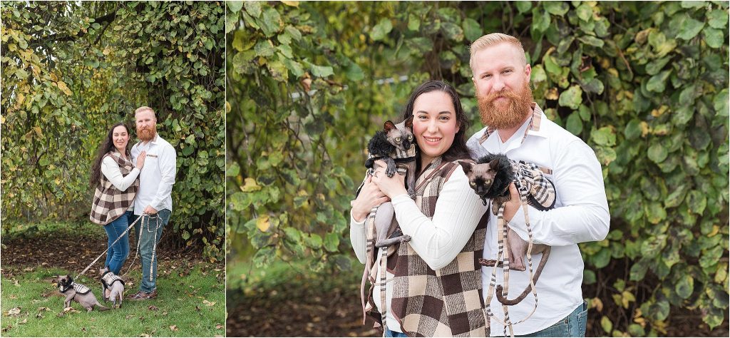 Couple poses for portrait with cats in Port Gamble, WA